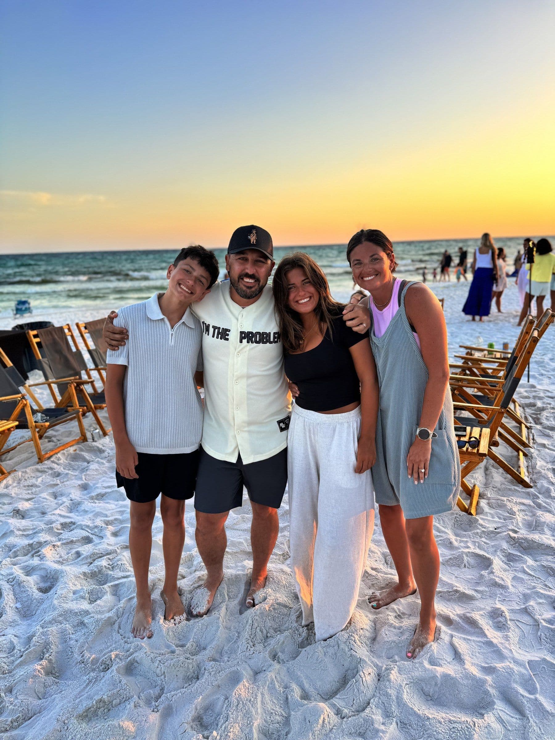 Joshua Brown and family on the beach at dusk